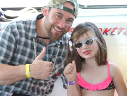 Father and daughter posing for a photo on the Pride of Maui boat.