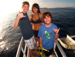 Woman with her sons on the bow of the Pride of Maui.