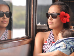 Woman with her baby looking out the window